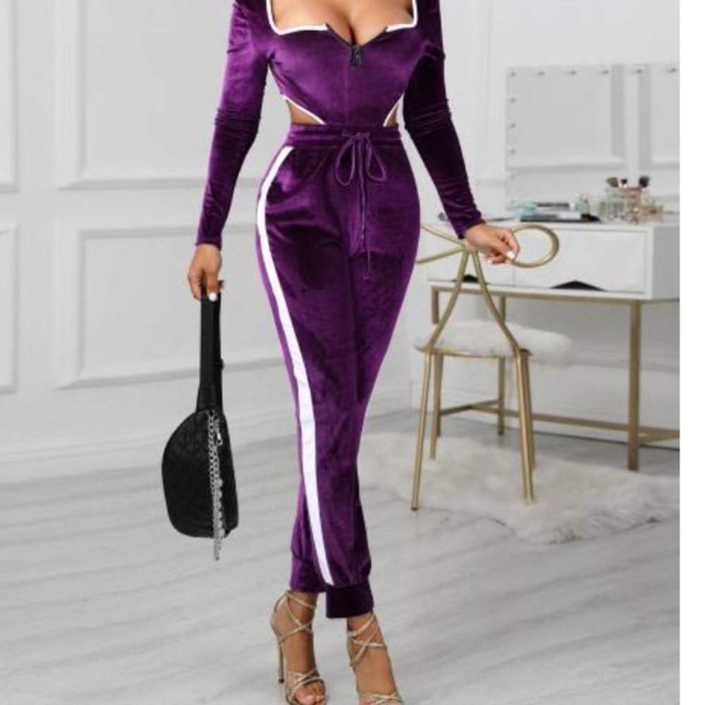 Purple Jumpsuit w cut-out sides.